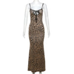 Stylish women's leopard print dress with thin straps, tie-neck detail, and sexy open back design for fall/winter parties and nights out.