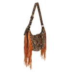 Side-angle view of the leopard print handbag with long brown fringe and an adjustable strap