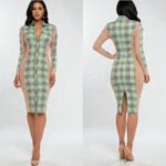 Long sleeve green and black plaid bodycon dress featuring sheer black mesh side panels and a 100% cotton body.
