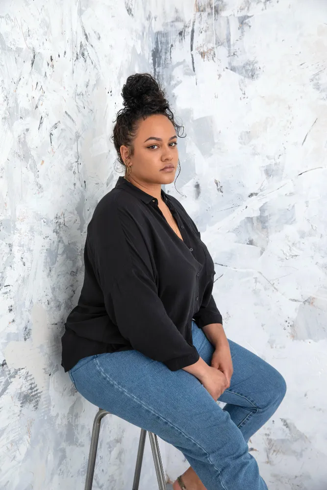 A Plus-Size Woman Exuding Body Positivity And Confidence.