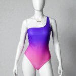 Women's one-shoulder one-piece swimsuit featuring a multicolor color-block print and a trendy side cut-out, shown on a mannequin is in a size small.