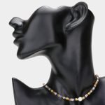 Gold/Multi-colored chic choker necklace featuring round pearl accents and metal faceted beads, adding a touch of elegance to your ensemble.