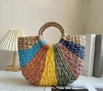 Multicolor Semi-Circle Woven Straw Handbag featuring a unique oval design, durable straw material, and spacious interior with cotton lining, perfect for casual outings or beach days.