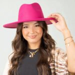 Women's pink felt rancher hat with a stiff crown and a 3-inch wide brim.