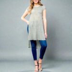 Woman wearing a Lt Olive (Light Olive Green) Short Sleeve Tunic Top with a round neck and a flowing high-low hem, providing full coverage.