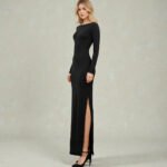 Woman wearing a sleek black long-sleeve bodycon maxi dress featuring an elegant boat neckline and a high side-slit detail for added movement.