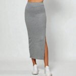 Heather grey long maxi skirt with a stylish side slit detail, crafted from a soft stretchy solid fabric in a minimalist chic style.